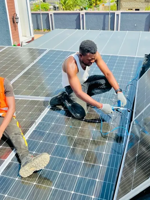 MC4 crimping and string wiring on rooftop solar array